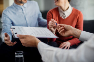 A couple signing a contract