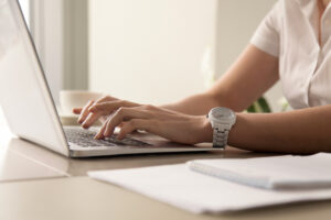 A closeup shot of hands typing on the keyword