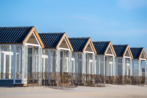A beautiful shot of resting cabins on a sand beach