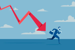 Businessman running from a large red downward arrow symbolizing financial decline.